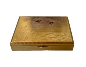 Polvera con caja de música